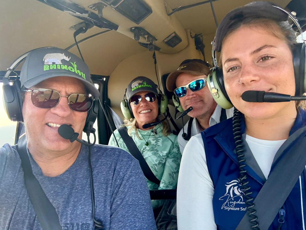Traveler learning alongside wildlife conservation professionals